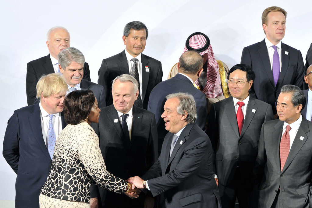 Minister Maite Nkoana-Mashabane greeting United Nations Secretary General, Mr Antonio Guterres during the group photo session at the G20 Minister's Meeting in Bonn, Germany