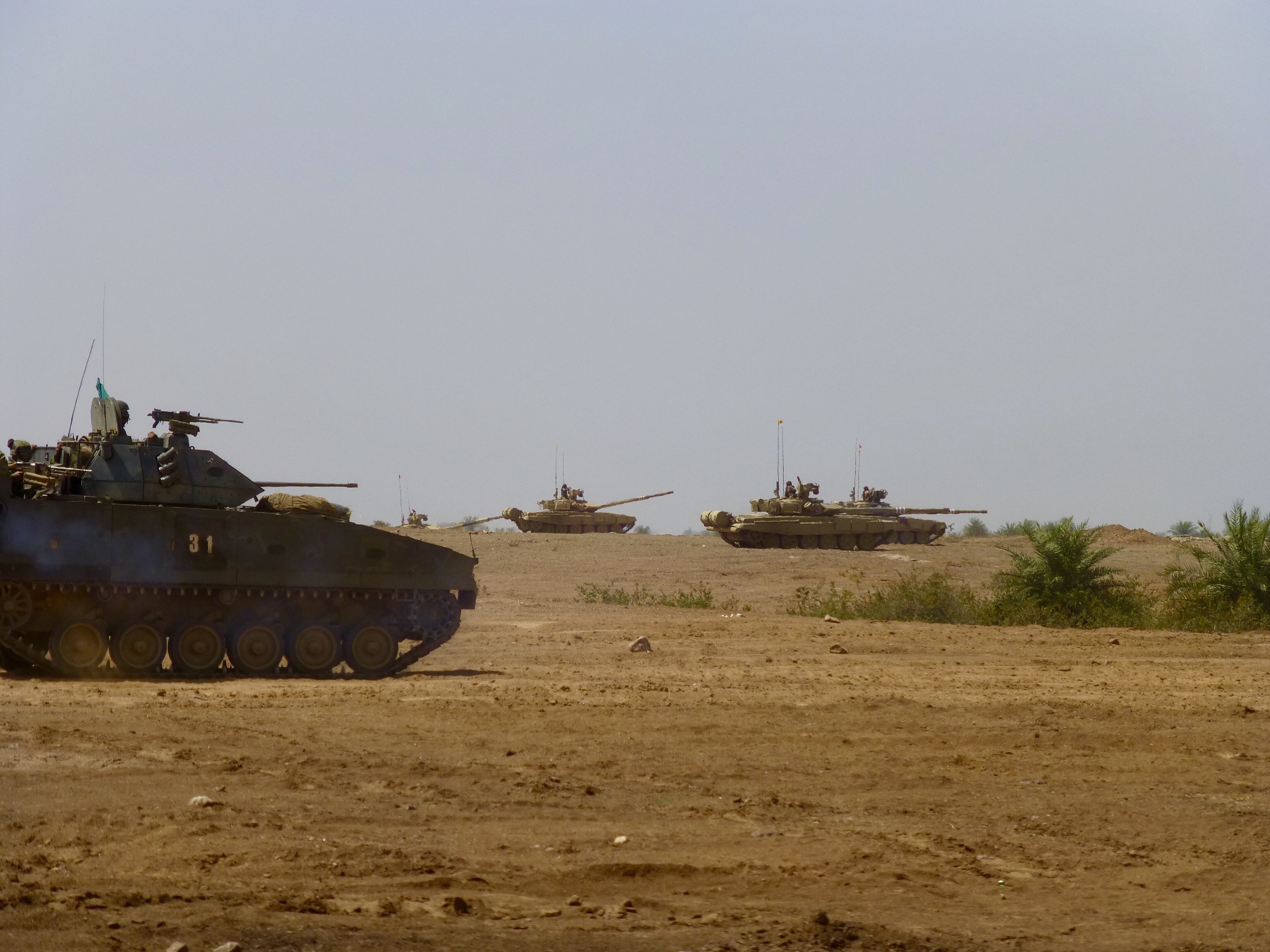 The SAF’s Bionix IFV (foreground) and IA’s T-90s (background) taking up firing positions during the joint live firing exercise. Photo courtesy: MINDEF