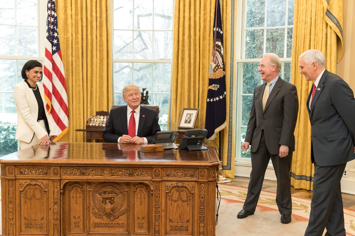 US President Donald Trump shares a laugh with (clockwise from left) Seema Verma, Administrator of the Centers for Medicare and Medicaid Services, Secretary Tom Price, U.S. Secretary of Health and Human Services, and Vice President Mike Pence in the Oval Office of the White House.