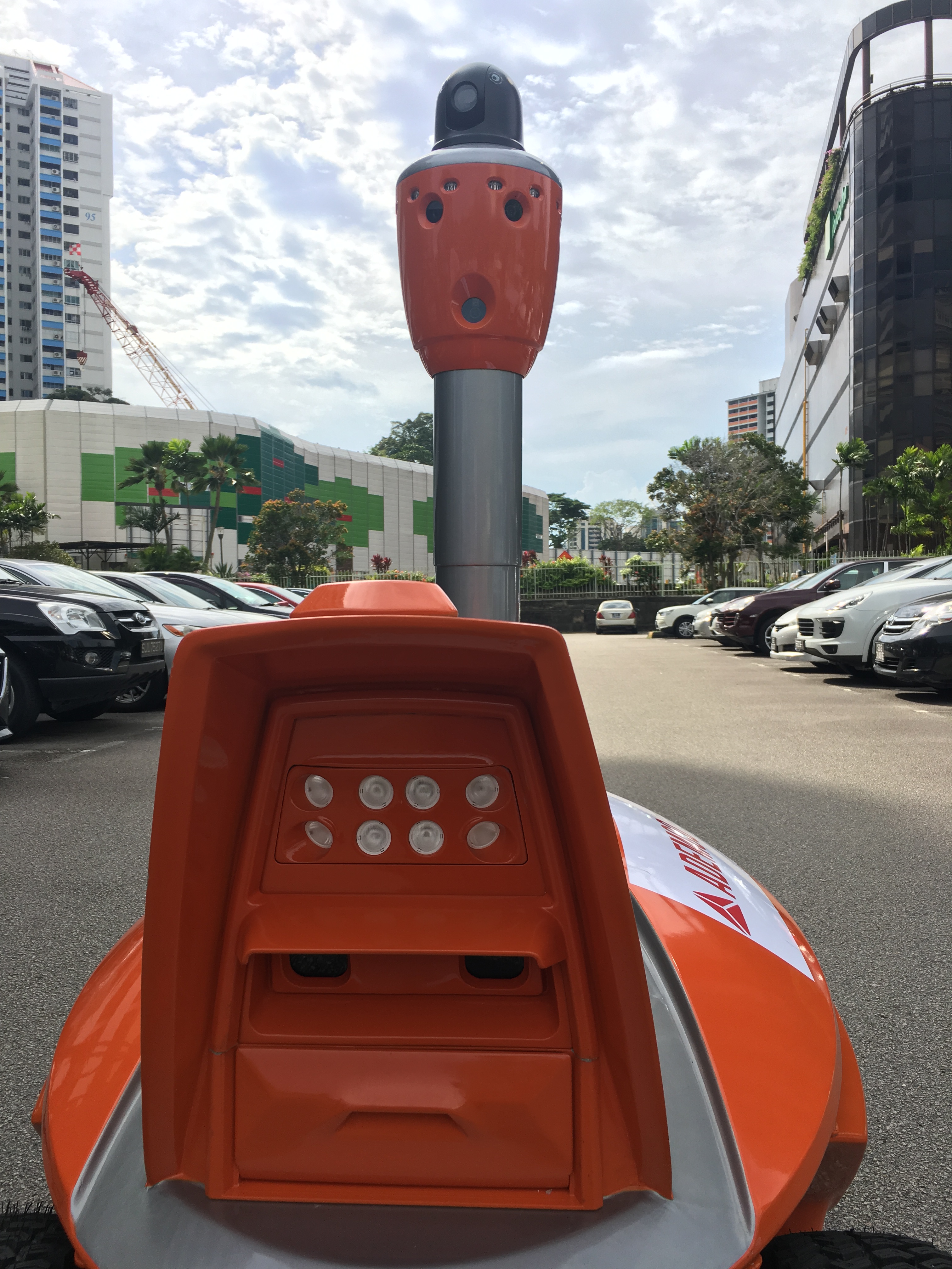 These robot security guards are 1.6m-tall, four-wheeled, seven-eyed robots