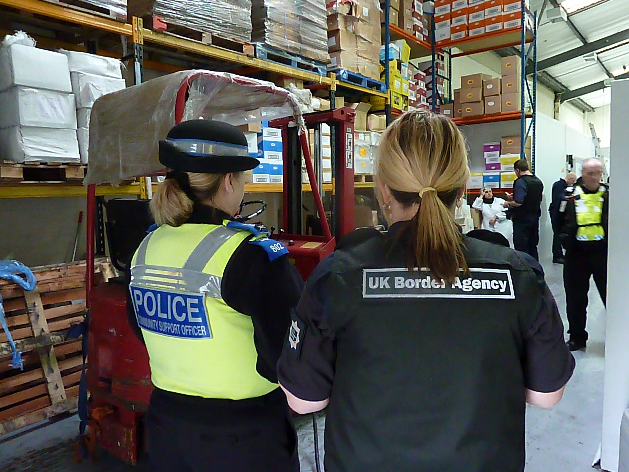 UK Border Agency and police conducting a raid
