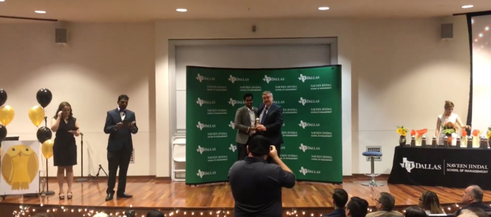Abinav Varma receiving the award from Dean of Business School at the awards ceremony. 