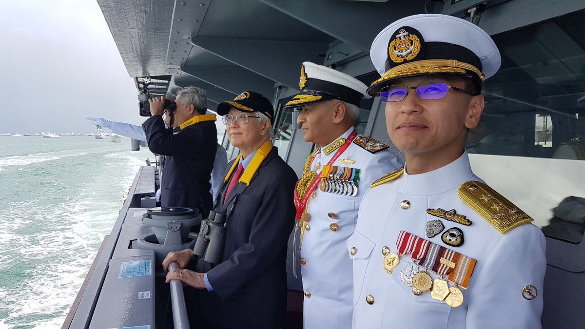 Indian navy chief Admiral Sunil Lanba with Singapore President Tony Tan Keng Yam and Singapore navy chief Rear Admiral Lai Chung Han on board RSS Independence during International Maritime Review