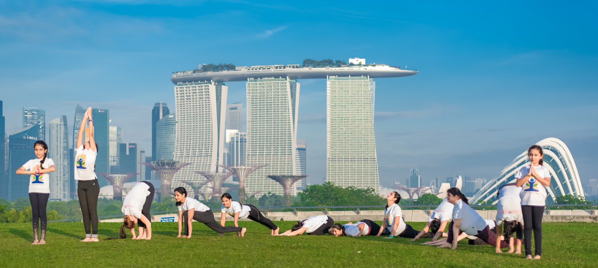 People practicing yoga in Singapore.