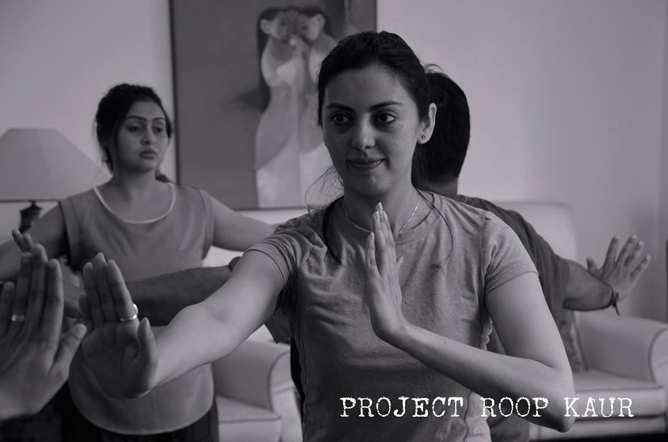  Ambreen Hamza concentrating on doing some of the mirror exercises that the Director, Edmund Chow, has instructed.