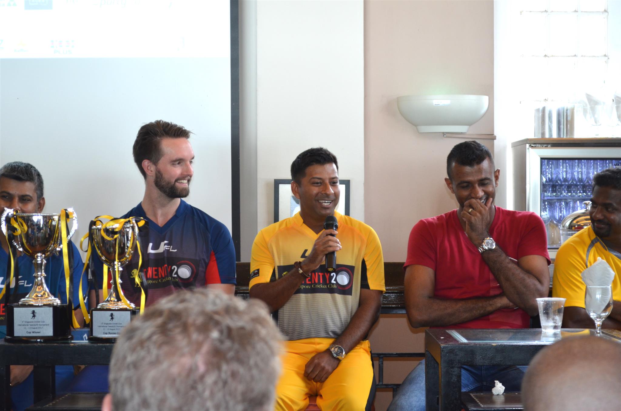 Muttiah Muralitharan (right) and Ferveez Maharoof (2nd right) laugh as SCC captain Riaz Hussein makes a joke about forgetting his well prepared game plan as soon as he met the two aces. Melbourne captain Matthew Brown (left) is also seen.