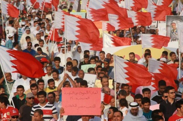 People holding flags during Bahrain Justice and Development Movement