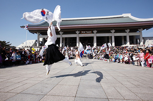 Crowds gather to watch a performance at the Independence Hall of Korea on National Liberation Day