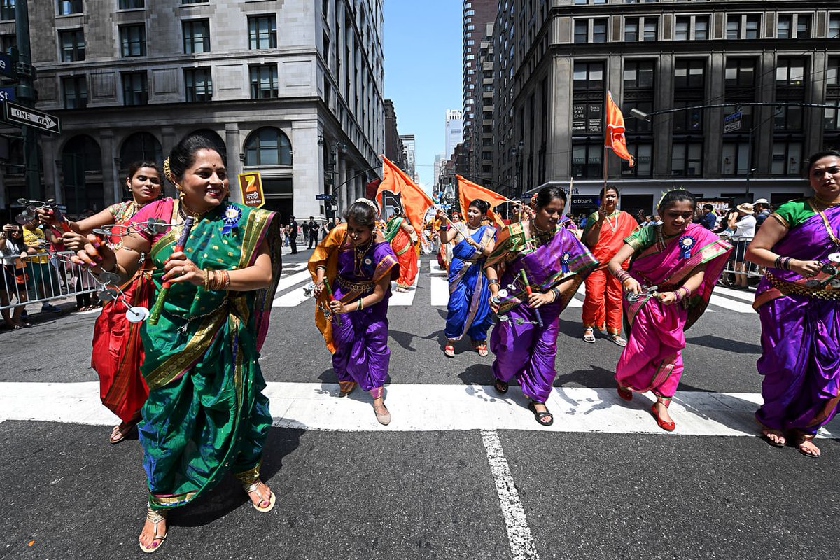 Women are seen walking at the India Day Parade in Nwe York.