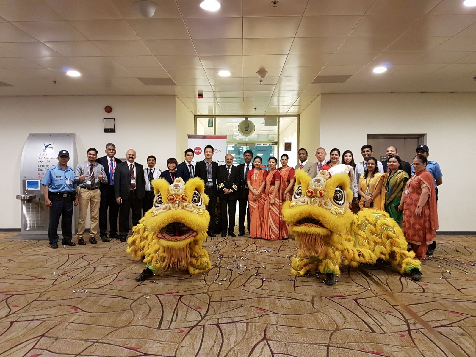 Beaming members of the Air India and Changi Airport Group (CAG) teams pose with the lions considered auspicious at business opening events in the Singapore Chinese culture. 