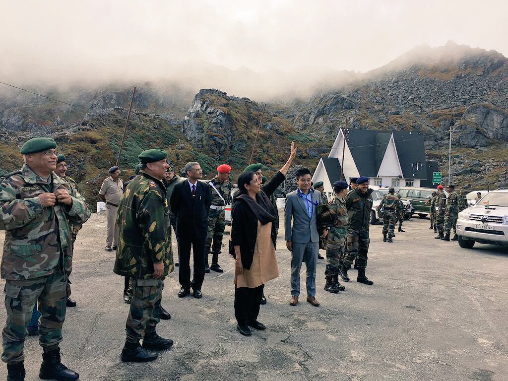 Indian Defence Minister Nirmala Sitharaman waves to Chinese citizens and troops (unseen) across the border at the Nathhu La outpost.
