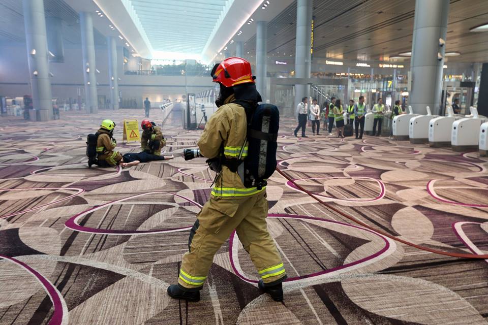Airport Emergency Officers putting out the fire in the full dress rehearsal conducted at Terminal 4 at Changi Airport. 