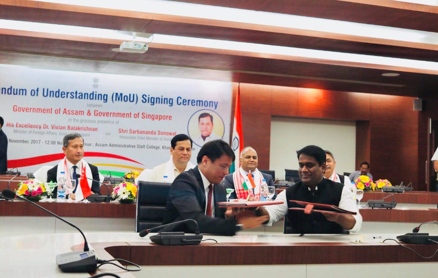 Singapore Minister for Foreign Affairs Dr Vivian Balakrishnan looks on the signing of MoU on City Greening by Singapore Cooperation Enterprise CEO Kong Wy Mun and Guwahati Metropolitan Development Authority Madhaiyaan Angamuthu.