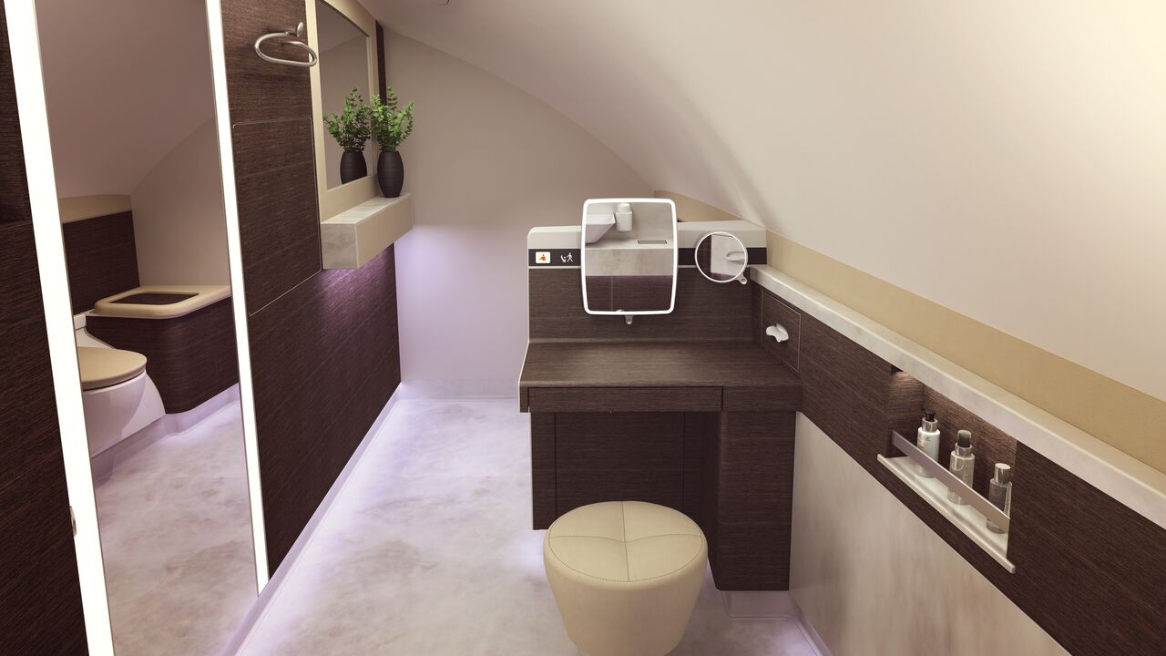 There is also a sit-down vanity counter in the stylishly furnished lavatory. 
