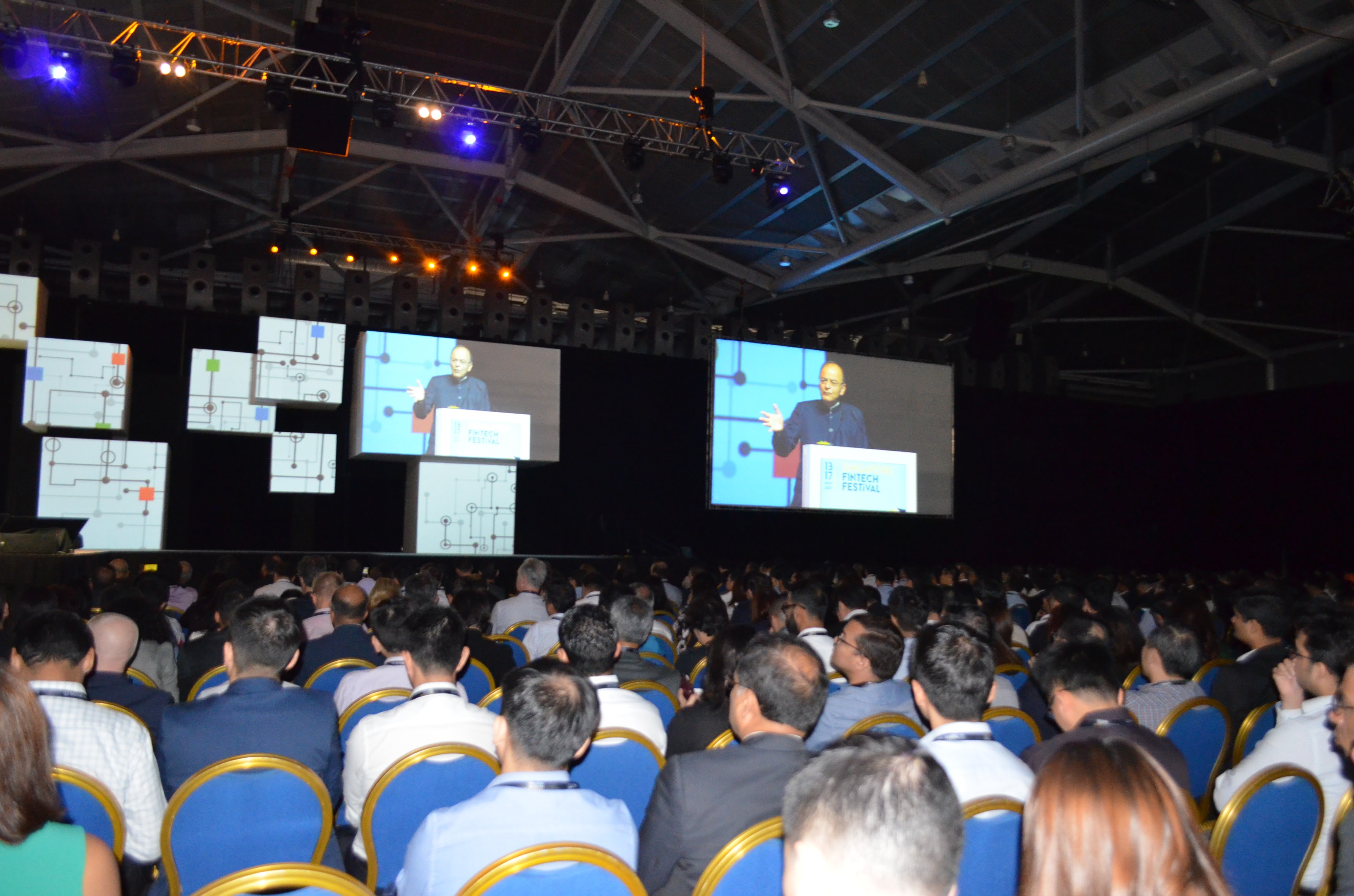 Summit participants gather to listen to the opening address.