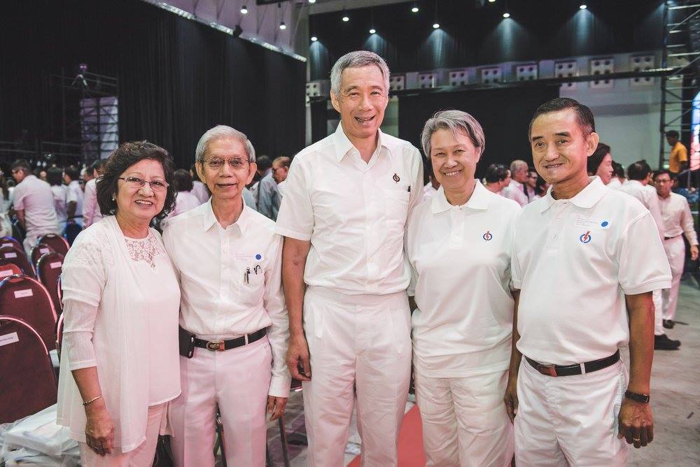 PM Lee Hsien Loong along with comrades Tan Seng Peng (second from left) and Goh Khon Chong (extreme right). Both comrades have served the PAP for 50 years. 