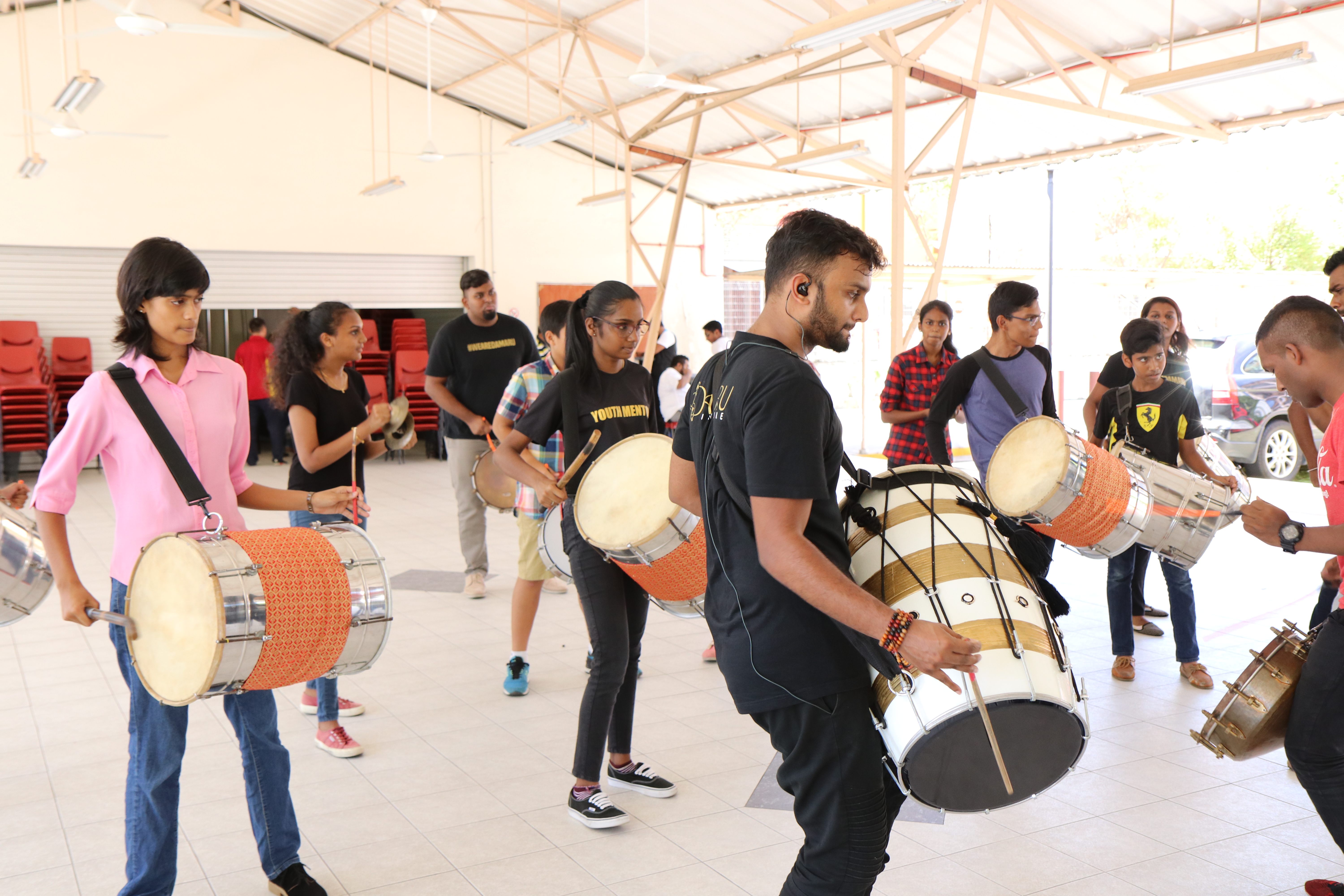 SINDA trains youth in playing various musical instruments.