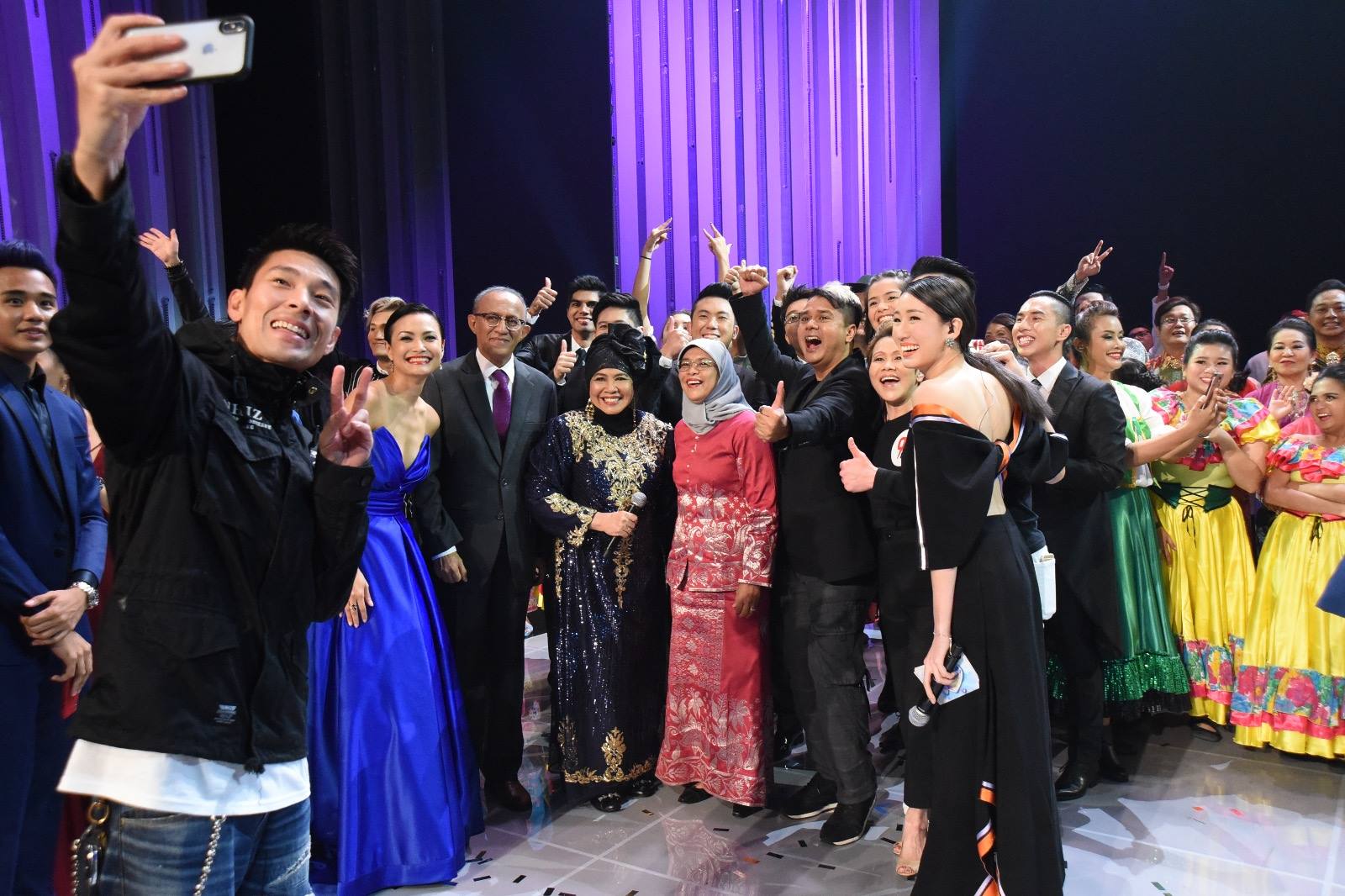 President Halimah Yacob along with performers after the finale item. 