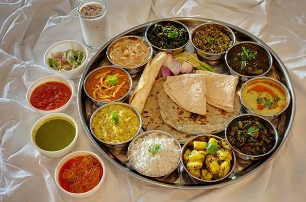The state's thali comprises of dishes that are sweet and tangy, namely methi na thepla, bhakhri, khatti mithi daal (sweet and sour lentil), aloo rasila, steamed rice, badshahi #khichdi etc