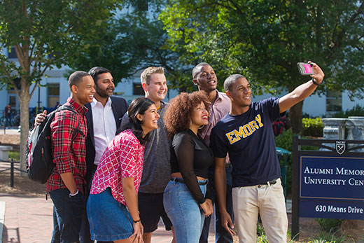 Ajay Nair (second from left), Emory’s senior vice president and dean of Campus Life, poses with students. Nair will leave Emory after March 31 to become the next president of Arcadia University.
