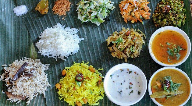 The thali comprises of healthy mix of rice, akki roti, dal, vegetables, rasam, sambar, vada, kosambari (salad), rava kesari (dessert) & high infusion of coconut