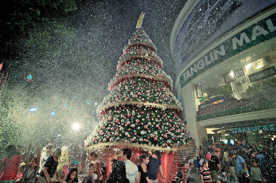 Snow made of foam is showered at the Tanglin Mall. 
