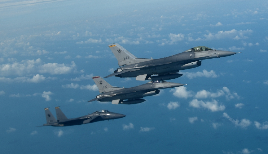 An RSAF F-15SG and two F-16s flying in close formation. Photo courtesy: MINDEF
