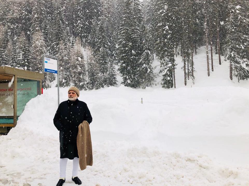 Indian Prime Minister Narendra Modi standing at the snow clad city of Davos where he is participating in the World Economic Forum meeting. 