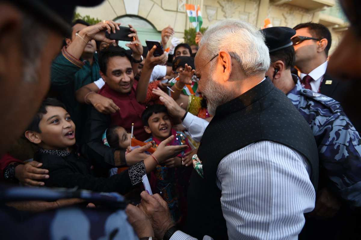 Children of Indian community enthusiastically welcoming Prime Minister Narendra Modi on his arrival at the hotel in Muscat.