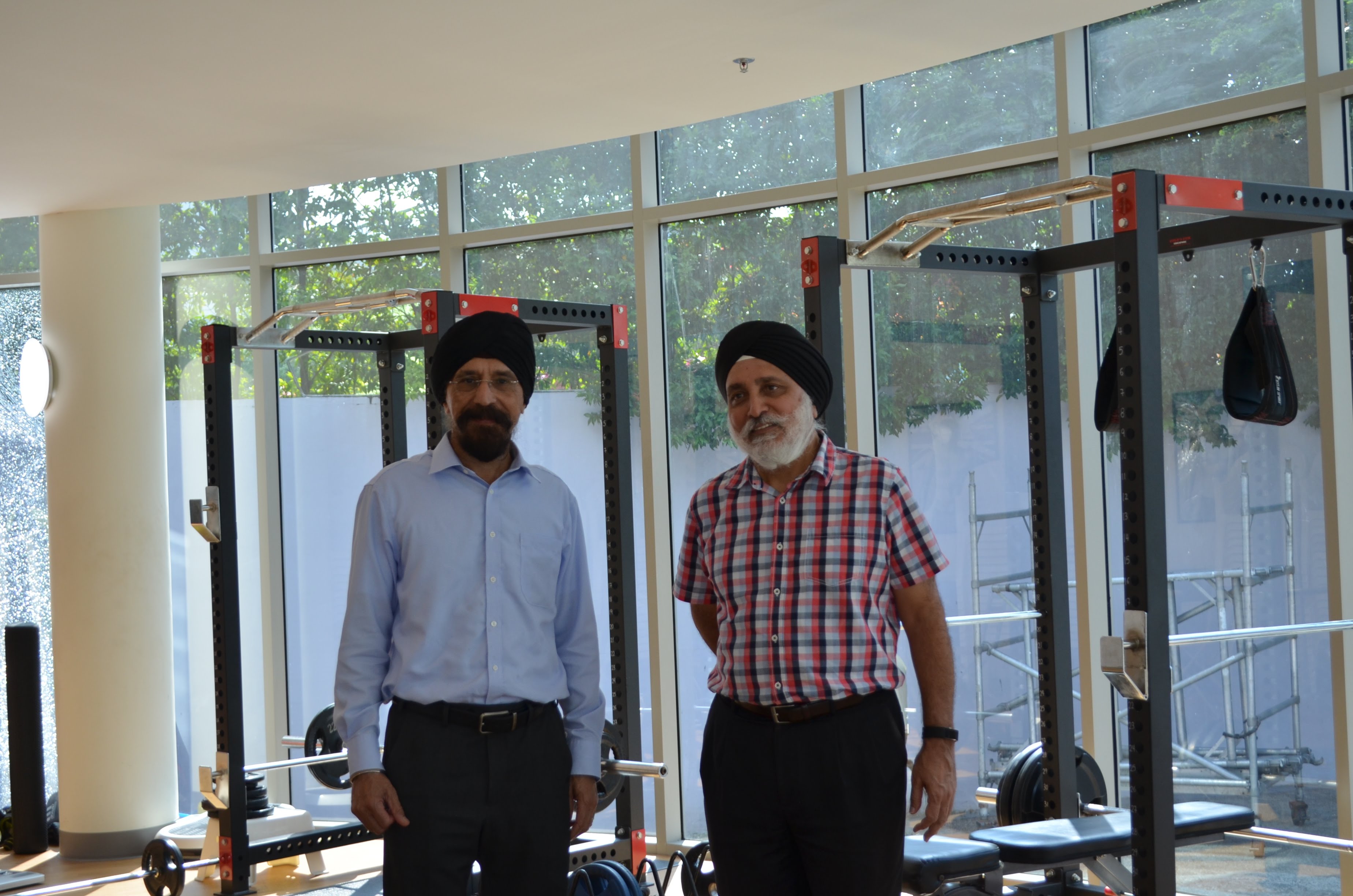 Mohinder Singh (left), seen here with SKA GM Albel Singh in the association's gym.