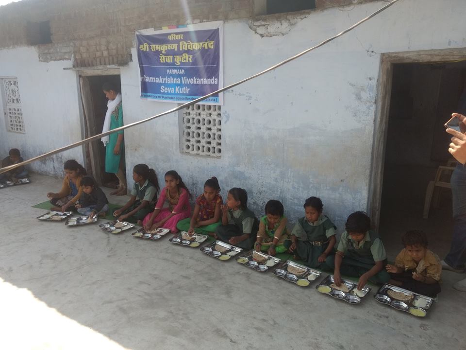Kids taking lunch at meals cum education centres for children called 'Sri Ramakrishna Vivekananda Seva Kutir' in Madhya Pradesh.
