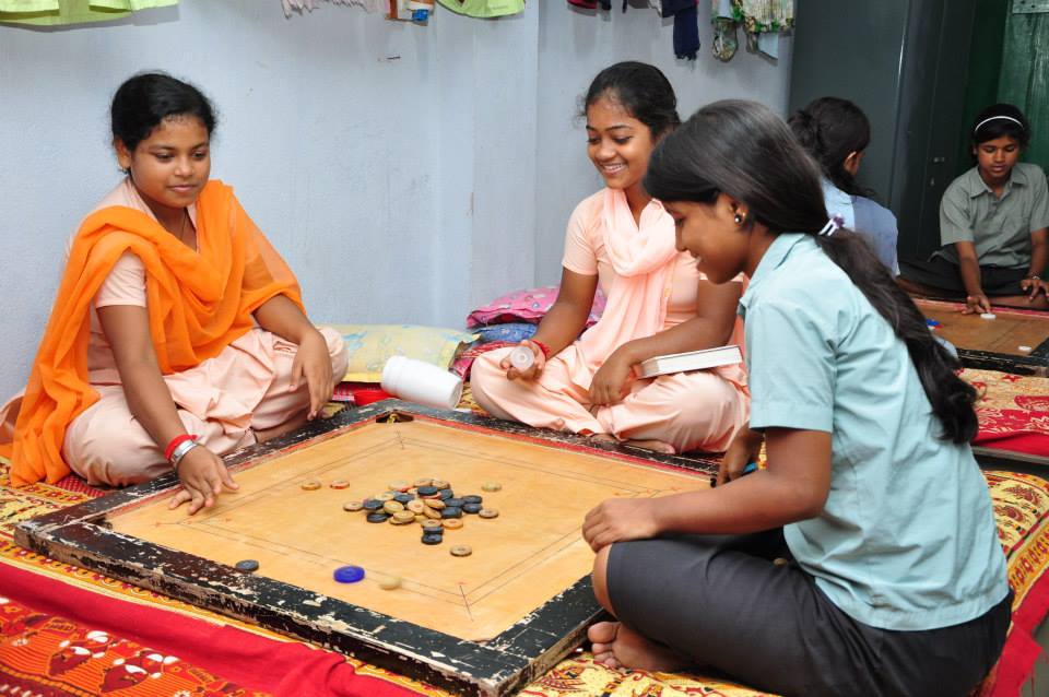 Students playing carrom during their free time at Parivaar. 