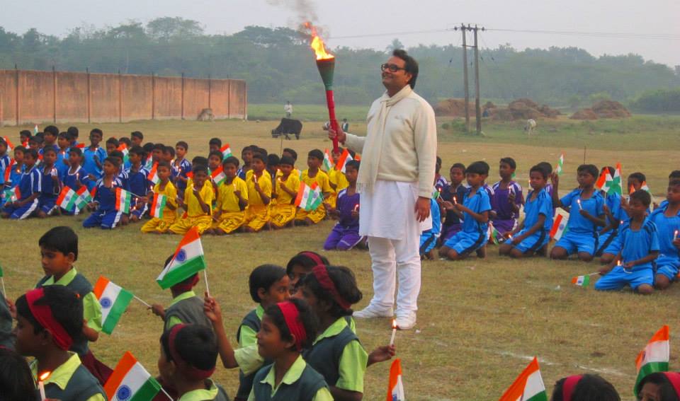 Vinayak Lohani holding the torch at the annual Athletic Meet at Parivaar metaphorically urging the students to stand up and express the vast potential hidden inside them. 