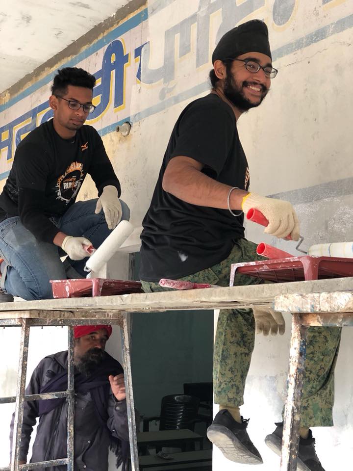 One of the volunteer of YSA is engaged in giving a facelift to the village school. Photo courtesy: Facebook page of YSA