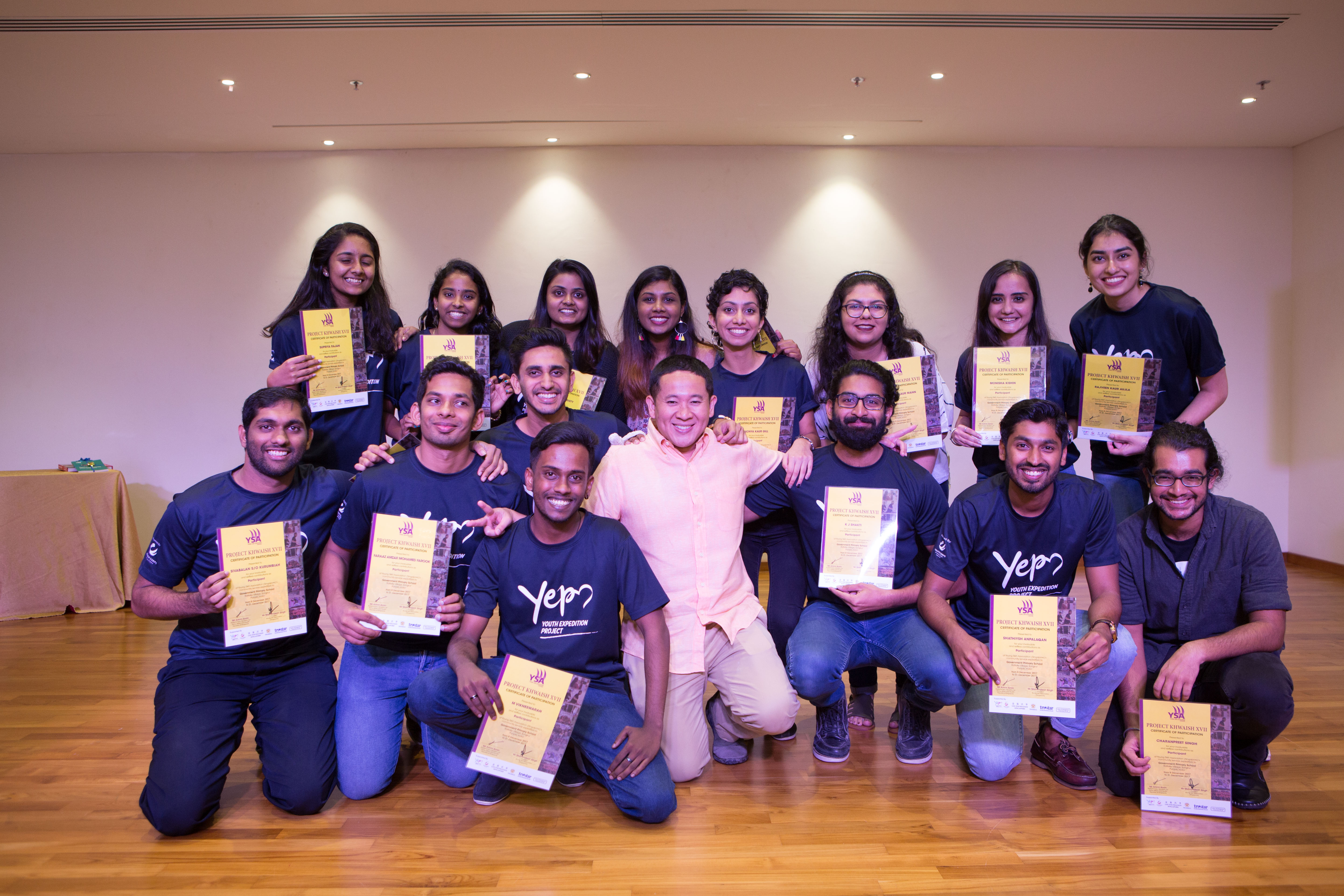 Parliamentary Secretary for Health and Home Affairs of Singapore Amrin Amin along with volunteers of YSA during the certificate presentation ceremony in Singapore. 