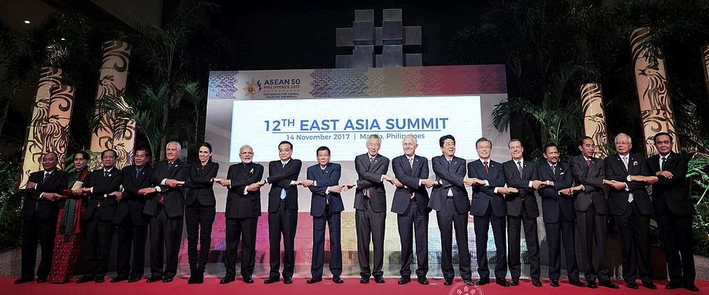 Leaders from the Association of Southeast Asia Nations (ASEAN) chaired by President Rodrigo Roa Duterte along with the leaders of the dialogue partner countries do the ASEAN handshake as they pose for a photo prior to the start of 12th East Asia Summit at the Philippine International Convention Center on November 14, 2017. 