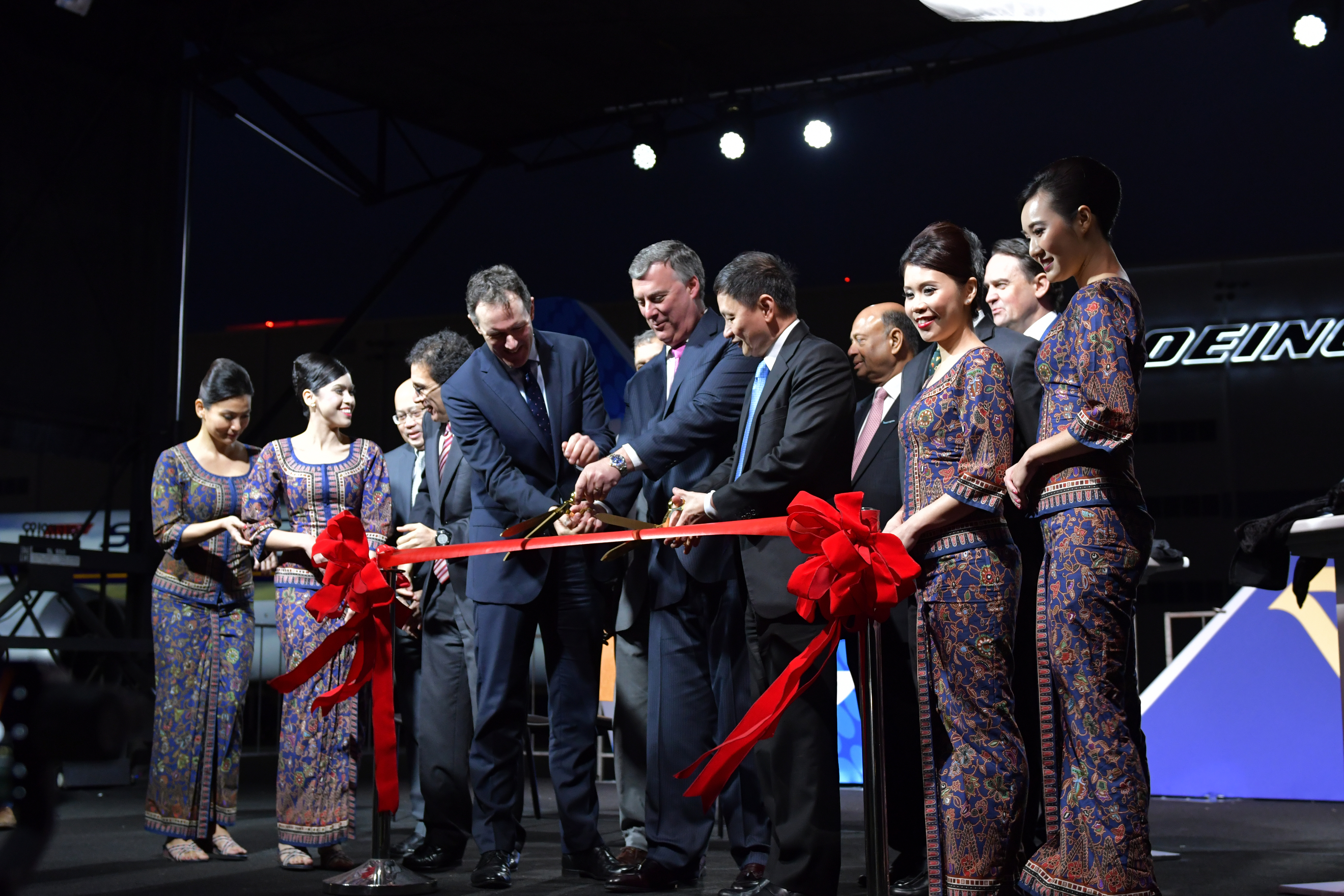 (From centre left to right) Dominic Harwood, Director Customer and Services for Civil Aerospace, Kevin McAllister, Boeing Commercial Airplanes president and chief executive officer and Goh Choon Phong, chief executive officer of Singapore Airlines cutting a ceremonial ribbon to celebrate the delivery of the first Boeing 787-10 airplane to SIA at North Charleston, South Carolina. 