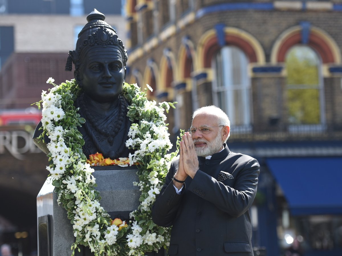 PM Modi with UK PM Theresa May at the Crick Institute (top) and garlanding the Basaveshwara statue yesterday