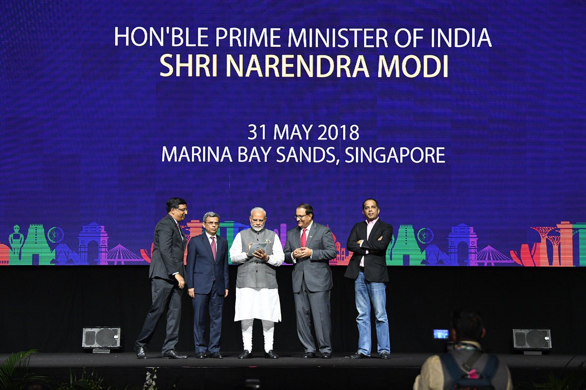 PM Modi launching RuPay, Bhim App and UPI enabled remittance app in Singapore. Photo courtesy: Twitter/@MEAIndia