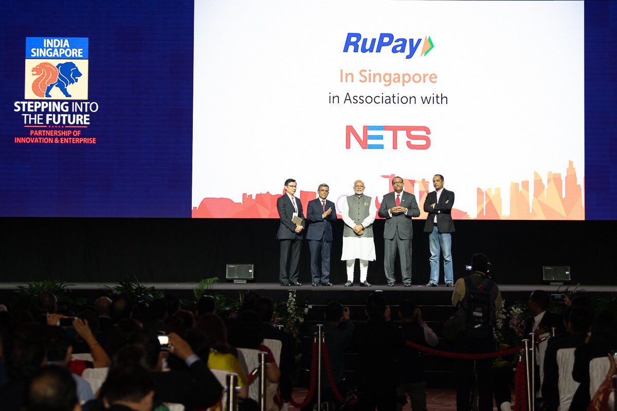 PM Modi (centre) inaugurating the RuPay-NETS payment scheme, one of three digital payment schemes launched at the event. Photo courtesy: MEA