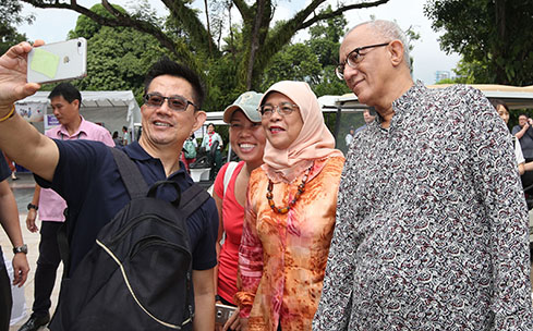 President Halimah taking a selfie with the public during the Labour Day Open House. Photo courtesy: istana.gov.sg