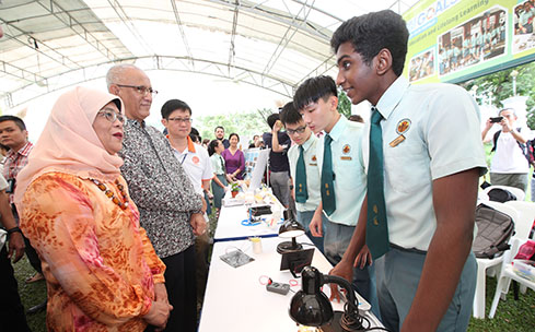 President Halimah interacting with students during the Labour Day Open House. Photo courtesy: istana.gov.sg