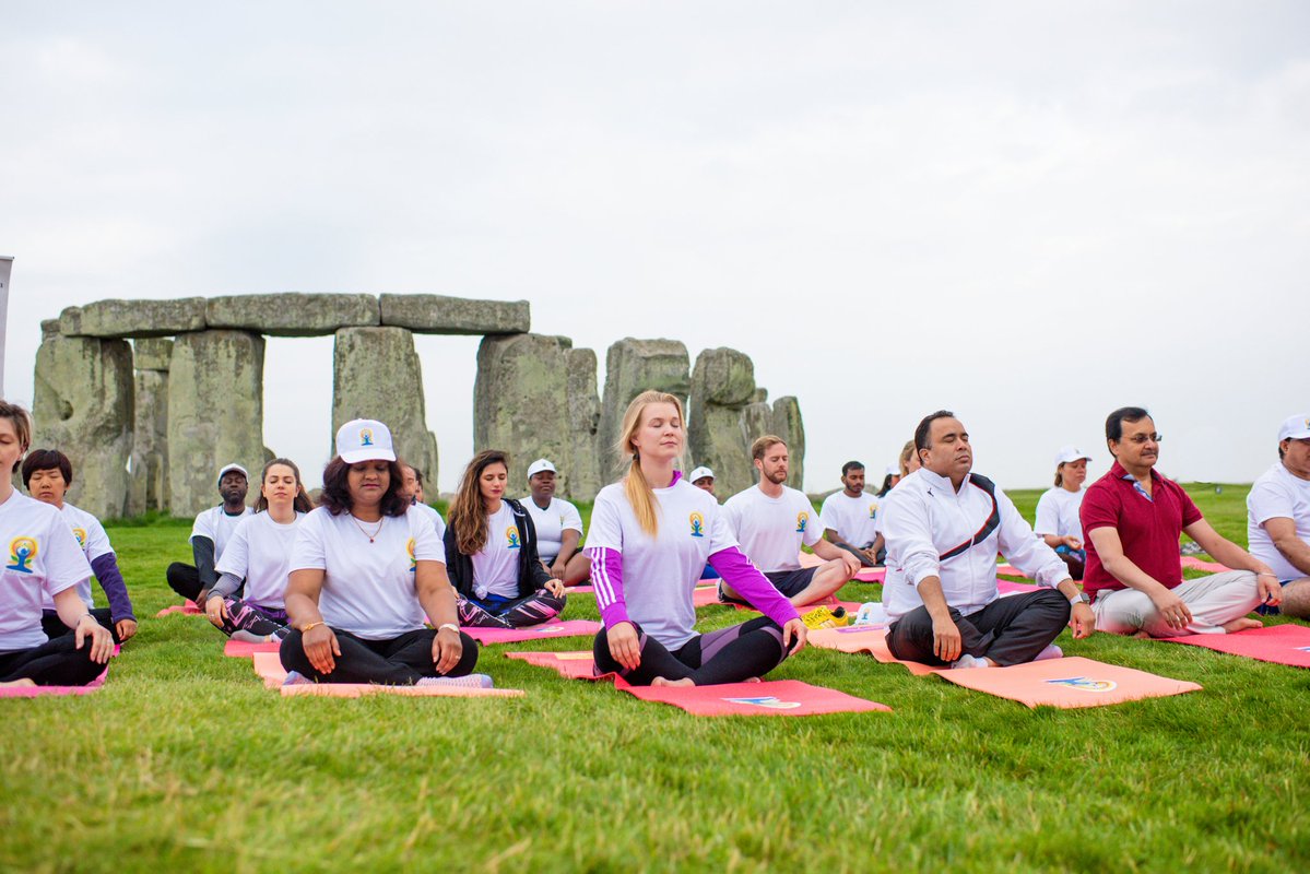 A yoga session being held at the Stonehenge heritage site to mark IDY 2018.
