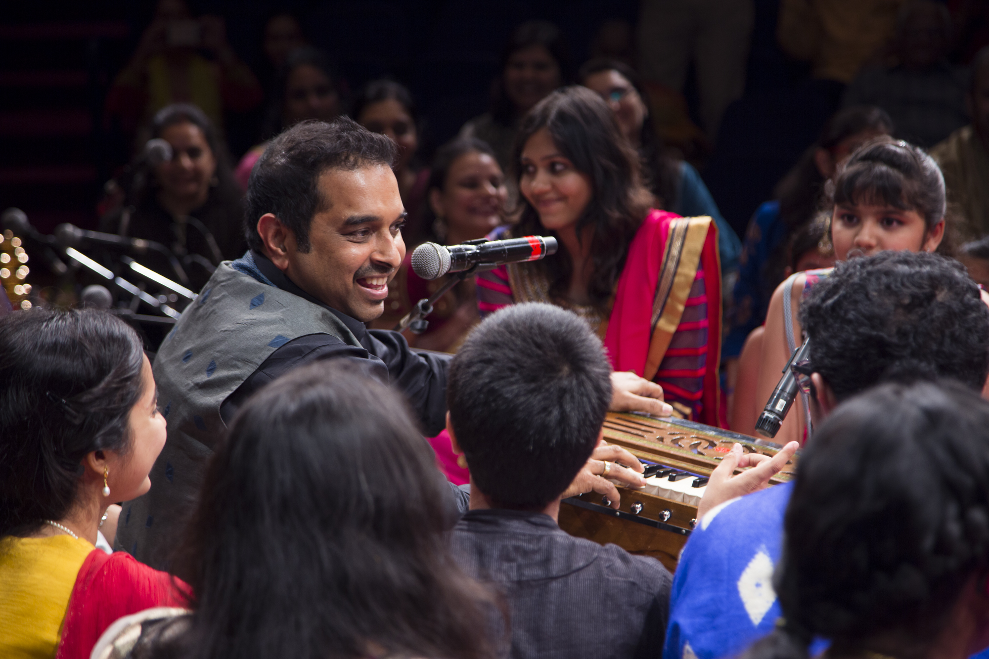 Shankar Mahadevan imparting music lessons to young children. 