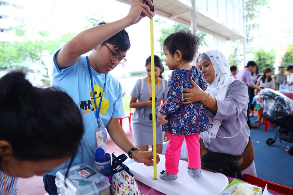 Height of a child being measured at a community health and developmental screening event at Boon Lay in Singapore. Photo courtesy: Facebook page of Minister Desmond Lee