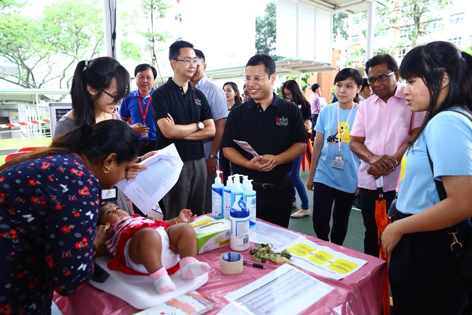 A child being examined at the health screening event in presence of Desmond Lee, Social and Family Development Minister of Singapore. Photo courtesy: Facebook page of Minister Desmond Lee 
