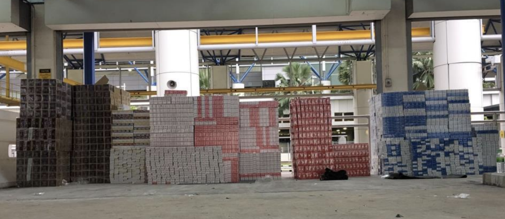 A total of 7,484 cartons of cigarettes detected in the two vehicles. Photo courtesy: ICA