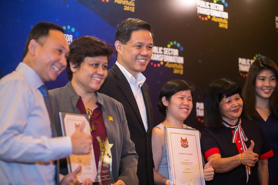 Chan Chun Sing along with winners at the Public-Sector Transformation Awards ceremony. 