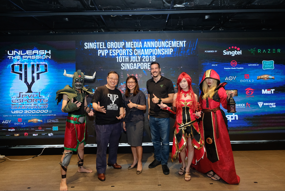(From left to right) Arthur Lang, CEO of Singtel's International Group; Carrie Kwik, Executive Director, Singapore Tourism Board and Hilmar Hahn, Associate Director, Product Marketing-Peripherals (Global) of Razer with cosplayers at the press announcement of Singtel's regional eSports league. Photo courtesy: Singtel