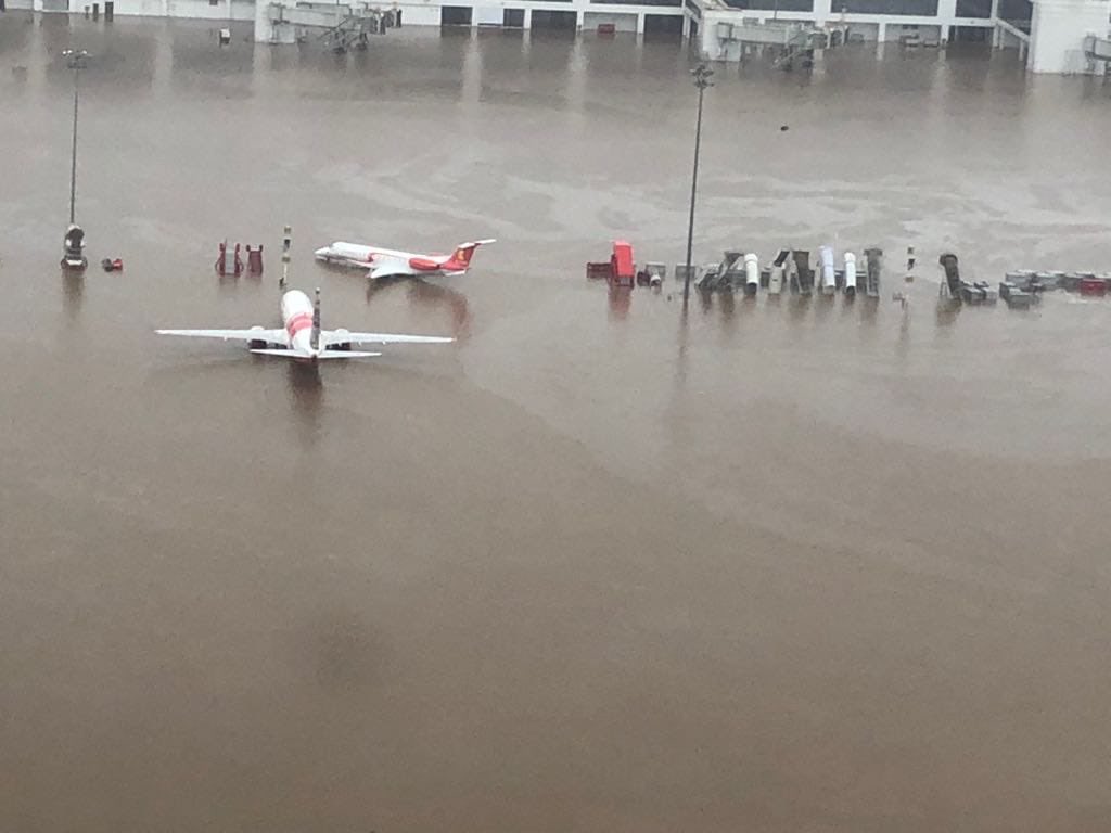 The flood has disrupted air, rail and road traffic in several places., with the Kochi Airport inundated.